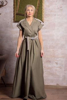 "Step into style with our Olive Green Military-Style Maxi Dress. This dress features a chic military-inspired design with short sleeves and a flattering high-waisted belt. The olive color exudes a sense of sophistication, making it perfect for various occasions. Whether you're attending a special event or simply want to make a fashion statement, this dress has you covered. Key Features: 👗 Maxi Length 🌿 Olive Green Color 🎖️ Military-Inspired Style 👚 Short Sleeves 📜 High-Waisted Belt Embrace Olive Color Dress, Olive Colored Dress, Military Style Dress, Military Trends, Short Sleeves Dress, Green Gown, Sleeves Dress, Olive Green Color, Color Dress