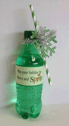 a green bottle with a christmas message on it and a candy cane in the top