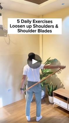 a man in white shirt and blue pants holding a broom with text overlay reading 5 daily exercises loosen up shoulders & shoulder blades