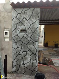 there is a cement wall that has been painted