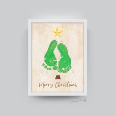 a green handprinted christmas card with the words merry christmas on it and a star above