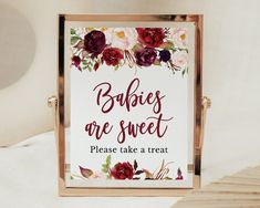 there is a sign that says babies are sweet please take a treat with flowers on it