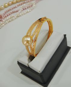 1971 Pearl Wedding Bracelet With 17 Jewels, High Luster Pearl Bracelet Gift, Elegant Gold Pearl Bangle, Luxury Oyster Pearl Bracelet As Gift, Gold Pearl Bangle Perfect As A Gift, Gold Pearl Bangle As Gift, Pearl Bangle As Gift, Gold Pearl Bangle For Gift, Anniversary Pearl Bangle Bracelet