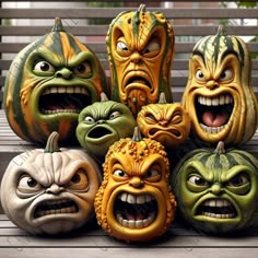 several pumpkins with faces painted on them are sitting on a wooden bench in front of some benches