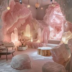 a room filled with lots of pink rocks and ice formations on the walls, lights hanging from the ceiling