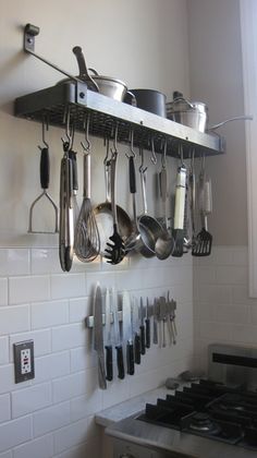 pots and pans are hanging on the wall