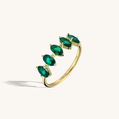 The 5 Stone Emerald Ring will demonstrate your taste with its elegancy so that you can feel yourself more stylish and special at any time of the day with the 5 Stone Emerald Ring, which will gather all the attentions around you with its sparkly emerald coloured stones, and you can make your special moments even more special. - Made in 14k solid gold - Decorated with handset emerald coloured cubic zirconia stone on 14k solid gold - Band Width: 1.45 mm / 0.057 inches- Ring Width: 18.95x6.19 mm / 0 Gemstone Jewellery Design, Dainty Band, Gemstone Collection, Luxury Jewelry Brands, Time Of The Day, Solid Gold Band, Full Eternity Ring, Linking Rings, Emerald Color