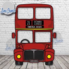 a red double decker bus on a wooden floor