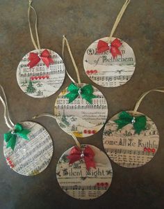 four christmas ornaments made out of sheet music