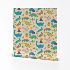 a paper bag with colorful dinosaurs on it