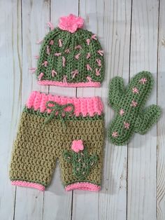 a crocheted cactus hat and diaper cover next to a cactus mitt