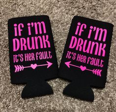 two black can coolers with pink writing on them sitting on the floor next to each other