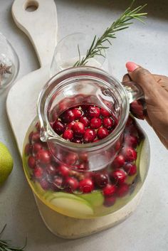 Get ready to make your holiday gatherings memorable with our easy Christmas Sangria! This white wine cocktail is packed with the merry flavors of cranberries, apple and pear, a splash of ginger beer, and star anise. It’s absolutely perfect for entertaining a crowd. Just mix up a large batch of this delicious sangria and watch as your guests enjoy each festive sip .Grab your pitchers and get ready for toasts all around! #ChristmasSangria #HolidayCheers #FestiveDrinks Beef Noodle Stir Fry, Cranberry Punch, Gingham Apron, Summer Drinks Alcohol, Christmas Punch Recipes, Christmas Punch, Beef And Noodles, Punch Recipes, Cranberry Juice