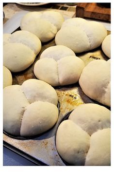 freshly made bread sitting on top of a baking pan