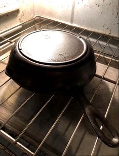 an old cast iron skillet sitting in the oven