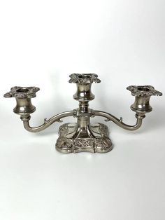 an antique silver candelabra with four candles