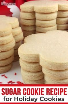 a pile of cookies sitting on top of a white plate covered in red sprinkles