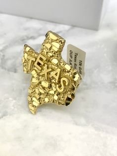 ● 10K Solid Yellow Gold TEXAS Nugget Ring Diamond Cut for Mens and Womens Ring ●Metal : 10K Solid Yellow Gold ●Purity : 10k with authenticity stamp ●Made in : United States ●Shape : Texas Nugget ● Size: 9 and 10 (Message us for custom size) If sizing is needed then message before placing your order for the price. The item will not be eligible for return if the sizing is done. ● Weight: 8 Grams ●Condition : Brand New ●Complimentary Premium Jewelry box included ●Free Shipping within U.S.A Be sure Apple Watch Design, Best Neck Tattoos, Premium Jewelry, Neck Tattoos, Texas Map, Womens Ring, Body Jewelry Piercing, Stamp Making, Ring Metal