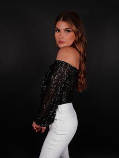 We are officially swooning over this lux bodysuit! The Party Must Go On Off Shoulder Bodysuit is perfect for your next holiday party or New Year's Eve celebration. Constructed on a stretchy sequins fabric in a off the shoulder, long sleeves silhouette, it's sure to turn heads when you walk into the room. The off the neckline is tastefully sexy, while the slight v-cut add a touch of glamour. Whether you're shaking your booty on the dance floor or sipping cocktails with friends, this bodysuit is s Def Leopard, Off Shoulder Bodysuit, Sequin Bodysuit, Sequins Fabric, New Year's Eve Celebrations, Cropped Cardigan Sweater, Next Holiday, Sherpa Jacket, Sequin Fabric