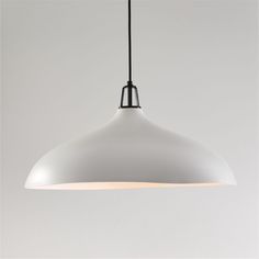 a large white light hanging from a ceiling