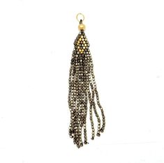 These are a lot of fun and will add a creative touch to your jewelry. (S58B10) This listing is for ONE (1) gold and oxidized toned beaded tibetan style tassle. Tassels are made of gold and oxidized toned beads. Pendant measures approx. 5in x 1in (including bail ) For all of our tassel styles and colors click here https://www.etsy.com/shop/jewelersparadise/search?search_query=tassel&order=date_desc&view_type=list&ref=shop_search These are also available in bulk following the link abov Gold Jewelry With Tassels And Round Beads, Gold Jewelry With Dangling Metal Beads, Beads Pendant, Pendant Gold, Spring Sale, Jewelry Plate, Gold Beads, Gold Pendant, Tassels