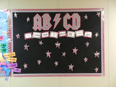 a bulletin board with pink and white stars in the middle, labeled 80th birthday