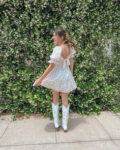 Country White Dress With Boots, White Cowgirl Boots With Dress, Dress Cowgirl Boots Outfits, Dress With Boots Country, Summer Outfits With Cowgirl Boots, Cowgirl Boots With Dress, White Slip Dress Outfit, Cowgirl Boots And Dress Outfit