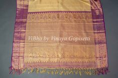 This royal and festive Light Pistachio Green And Purple Kanchi Silk Saree With Blouse features a stunning purple border with intricate gold zari work and comes with a matching blouse with work sleeves. Perfect for traditional occasions, the delicate tassels add a touch of elegance to this timeless piece. Made from high-quality silk, this saree is sure to make you stand out with its luxurious feel.. Gold Traditional Wear With Border For Puja, Purple Art Silk Traditional Wear With Border, Elegant Gold Traditional Wear With Border, Purple Traditional Wedding Wear With Border, Festive Gold Blouse With Border Detail, Gold Wedding Blouse Piece With Border, Gold Wedding Blouse With Border, Gold Blouse Piece With Border For Festivals, Blouse With Work