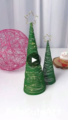 three small christmas trees sitting next to each other