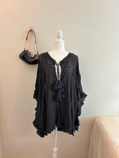 Vintage Black Free People Bohemian Poncho Pre-owned in great condition Size: S 100% cotton Brand: Free People Comfortable, cozy, cool. Lightweight in a deep black color with cute little tassel details. Black Long Sleeve Cotton Poncho, Summer Poncho With Fringe, Summer Long Sleeve Poncho With Fringe, Black Poncho For Summer, Oversized Black Summer Poncho, Black Beach Poncho One Size, Bohemian Black Poncho With Tassels, Black One Size Poncho For Beach, Black One Size Beach Poncho