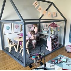 a child's play house with two children playing in it