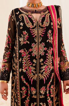 Traditional Black Embroidered Pakistani Salwar Kameez Dupatta Suit is an embroidered masterpiece that will give you a head-turning elegant look on a formal occasion. Lavish designs and fine floral designs make this Pakistani Party Dress an epitome of beauty and grace. Pakistani Kameez: The kameez has a premium Chiffon fabric. This kameez is emblazoned with lavish designs and embroidery. Floral designs, Sequins, and Beaming details make this beautiful organza kameez a perfect choice to wear to th Embroidery Floral Designs, Multi Color Dupatta, Pakistani Salwar, Pakistani Salwar Kameez, Chiffon Collection, Black Iris, Maria Black, Eid Collection, Chiffon Shirt