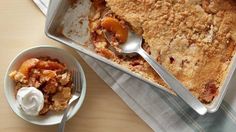 an apple cobbler and bowl of ice cream on a table