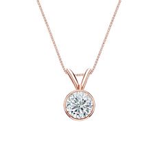 This dazzling solitaire pendant features a 0.50 ct. total weight round-cut natural diamond in 14k rose gold bezel setting. The pendant comes with a matching 18-inch box chain that secures with a spring ring clasp. Black Diamond Pendant, Gorgeous Wedding Rings, Black Diamond Studs, Diamond Solitaire Pendant, Halo Diamond Earrings, Diamond Pendants Designs, Solitaire Diamond Pendant, Colored Diamond Rings, Solitaire Pendant Necklace