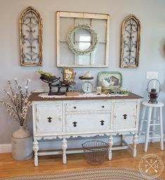 (paid link) If you are a child of the 90s, the idea of mirrored coffee tables would most likely feel both odd and garish. In an era where beige was the color of. Farmhouse Sideboard Decor, Wall Vignettes, Farmhouse Easter Decor Ideas, Buffet Decorating Ideas, Buffet Decor Ideas, Oster Dekor, Easter Decor Ideas, Farmhouse Buffet, Yellow Brick Home