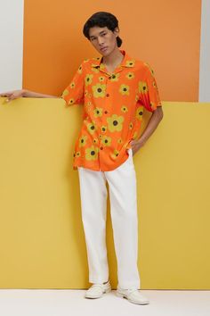 Orange shirt with flower prints and button placket.
Components: 1
Pattern: Printed
Type Of Work: Flower
Neckline: Shirt collar
Sleeve Type: Half
Fabric: Fluid cotton 
Color: Orange
Other Details: 
Stretch: No stretch
Model height: 5ft 11inches, wearing size S
Note: The pant worn by the model is not for sale
Occasion: Resort - Aza Fashions Retro Summer Shirt With Collared Neckline, Patterned Camp Shirt With Floral Print And Relaxed Fit, Collared Shirt With Floral Print In Patterned Color, Collared Shirt With Floral Print In Patterned Design, Patterned Collared Shirt With Floral Print, Patterned Floral Print Camp Shirt With Relaxed Fit, Retro Collared Shirt For Summer, Summer Patterned Hawaiian Shirt, Orange Collared Tops For Summer