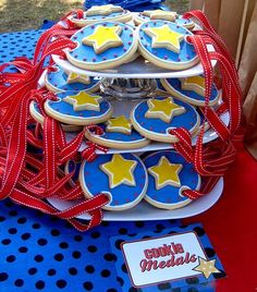 cookies are stacked on top of each other with red, white and blue ribbons around them