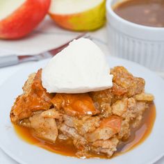 a white plate topped with apple pie and whipped cream