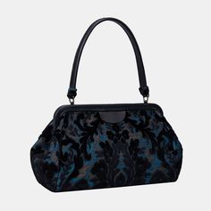 Crafted with carpet and luxurious lambskin leather, this semi-structured shoulder bag stands on its own for easy access, and it's closed with invisible magnets integrated within the frame complemented by cowhide leather patches for added flair.This is a design modified from the top handle purse by adding 4.50" to the handle drop, the handle drop of this purse is 9.50" which is perfect for shoulder carry. Overall measurements:• Bottom Width: 12-1/2"• Top Hinge Width: 11"• Depth: 4-3/4"• Height: 6 Iconic Purses, Elegant Black Velvet Bag, Gothic Bags Handbags, Goth Bags Handbags, Black Gothic Bag With Hardware, Gothic Shoulder Bag With Hardware, Large Travel Bag, Work Tote Bag, Buy Bags