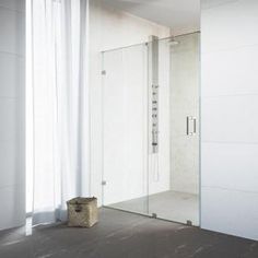 an empty room with a glass shower door