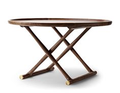 a wooden table with two crossed legs