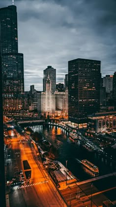 the city skyline is lit up at night