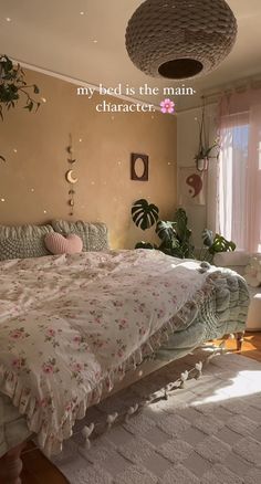 a bedroom with a large bed and plants on the wall next to it's windows