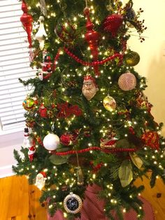 a christmas tree decorated with ornaments and lights