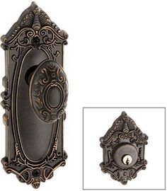 an antique style door handle and knob with ornate design on the front, shown in bronze