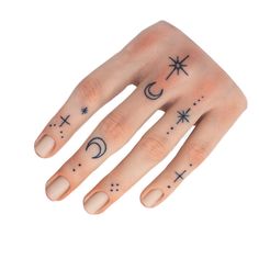 a woman's hand with stars and moon tattoos on her left thumb, while the other hand has a crescent tattoo