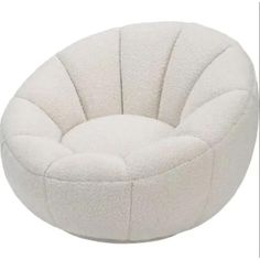 a white round chair sitting on top of a floor