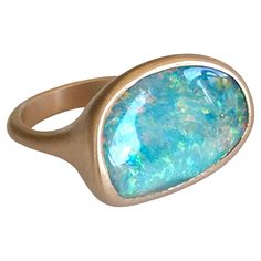 Dalben design 18k rose gold satin finishing ring with a 9,7 carat bezel-set organic shape magnificent Queensland mine Australian boulder opal . The Australian Opal have blue , pink and green spots. Ring size US 7 1/4- - EU 55- re-sizable to most finger sizes. Bezel setting dimension: width 21,1 mm, height 14,5 mm. The ring has been designed and handcrafted in our atelier in Italy Como with a rigorous quality workmanship . For a faster shipping service please choose "Buyer arranged shipping Free" Opal Rose Gold Ring, Italy Como, Rose Gold Satin, Rose Gold Opal Ring, Australian Boulder Opal, Gold Satin, Australian Opal, Boulder Opal, Organic Shapes