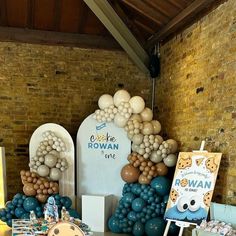 a table with balloons and decorations on it