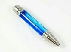 a blue and silver pen sitting on top of a white table